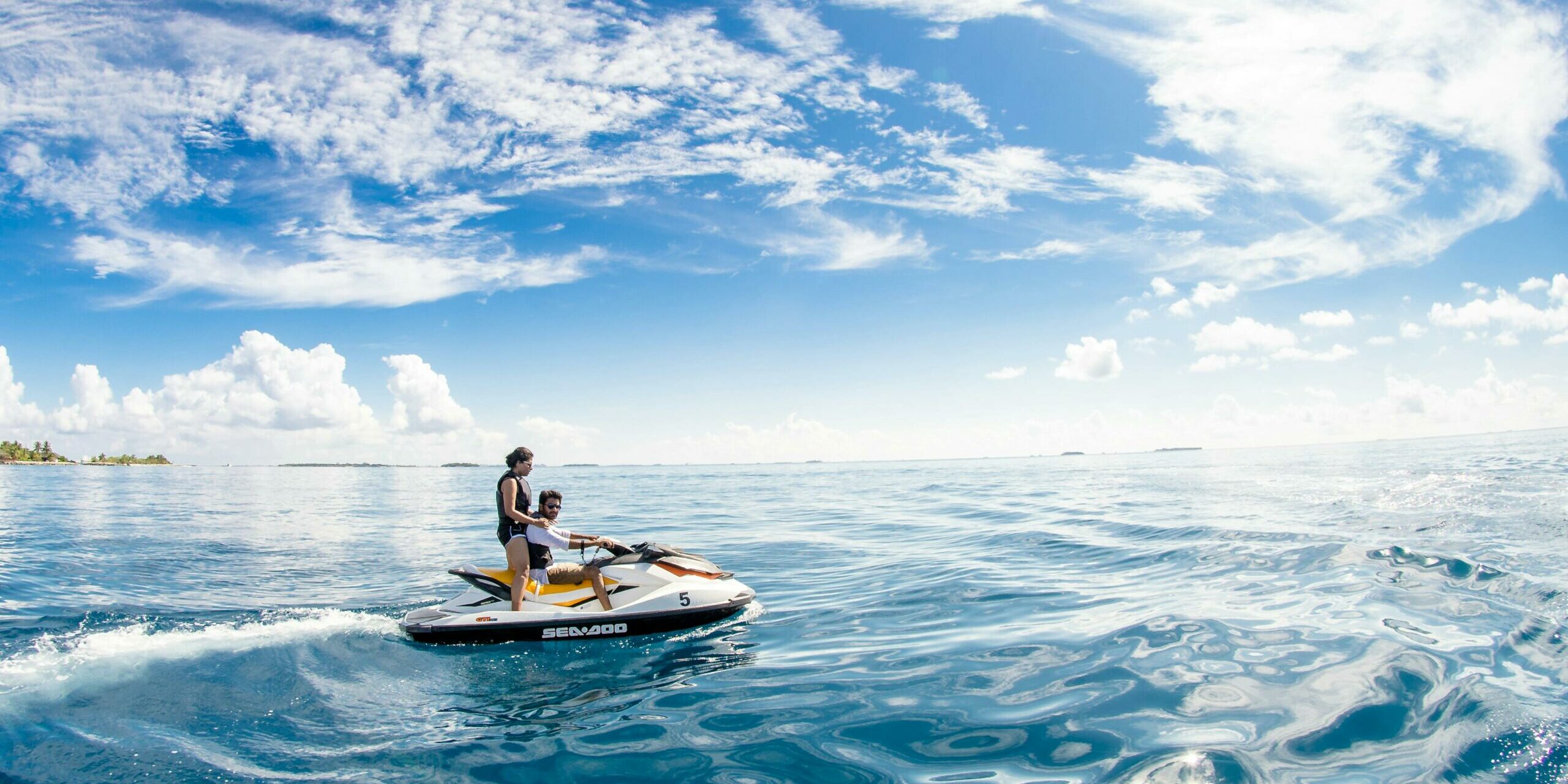 Guests riding on a jet ski in the open water Tourist arrivals in Maldives reach amazing numbers.