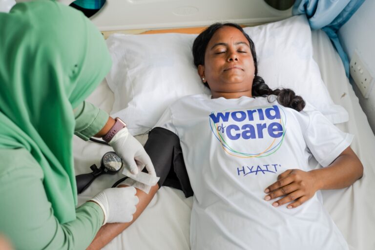 A member of Alila Kothaifaru Maldives donating blood for Global Month of Service